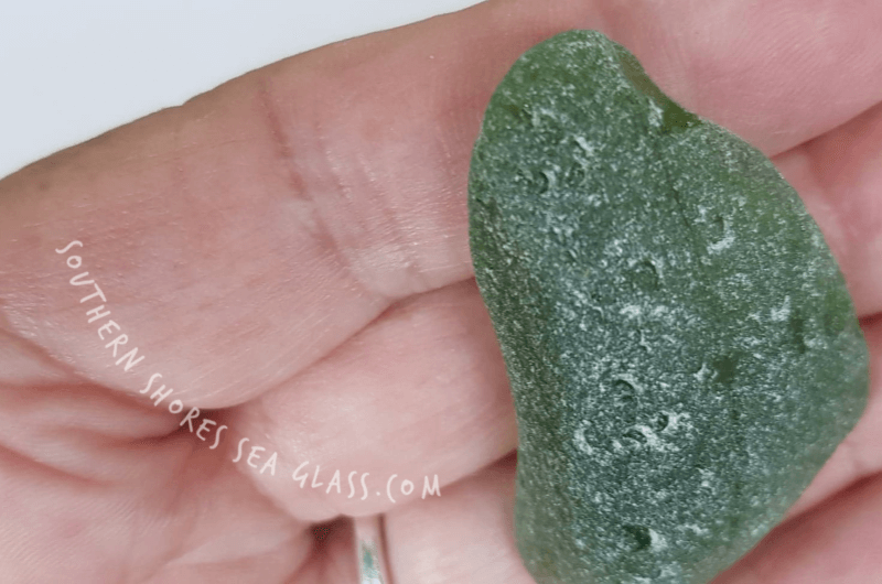 c shaped groves on sea glass